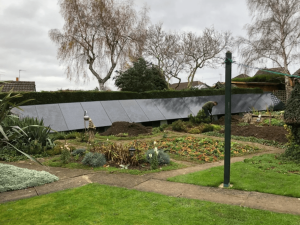 Solar panels along the back of a UK garden